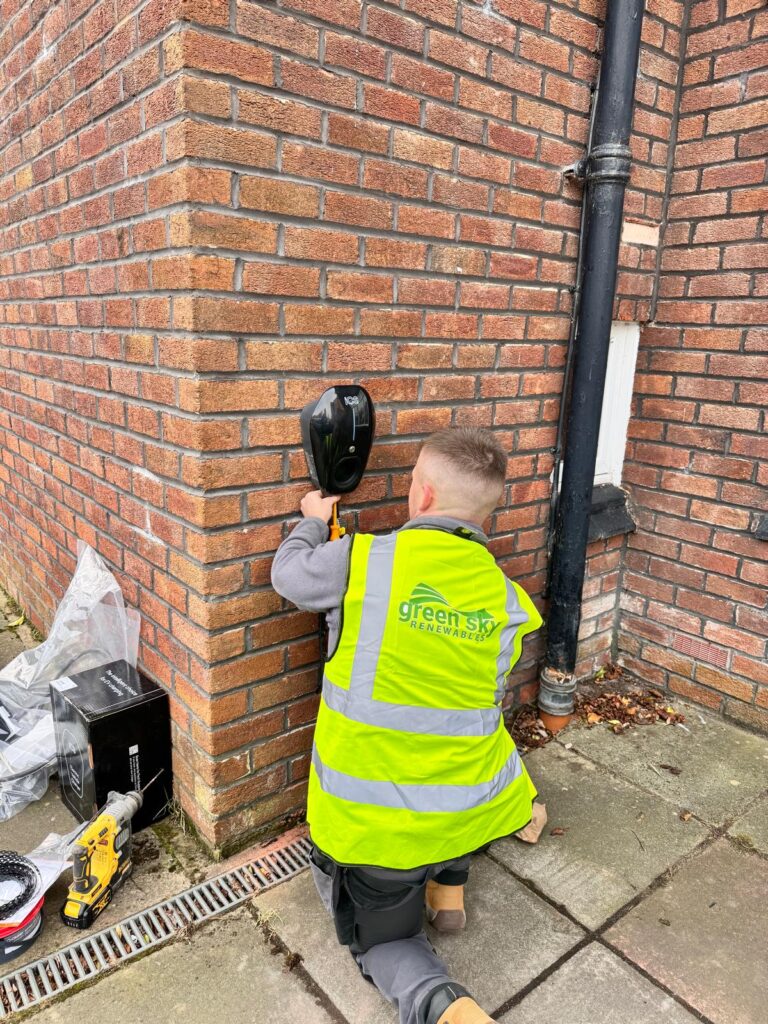 Engineer installing an ICS EV charger in Manchester