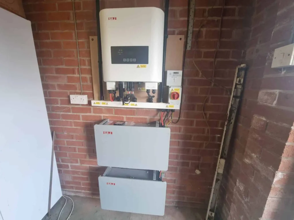 Solar inverter and battery storage system mounted on brick wall